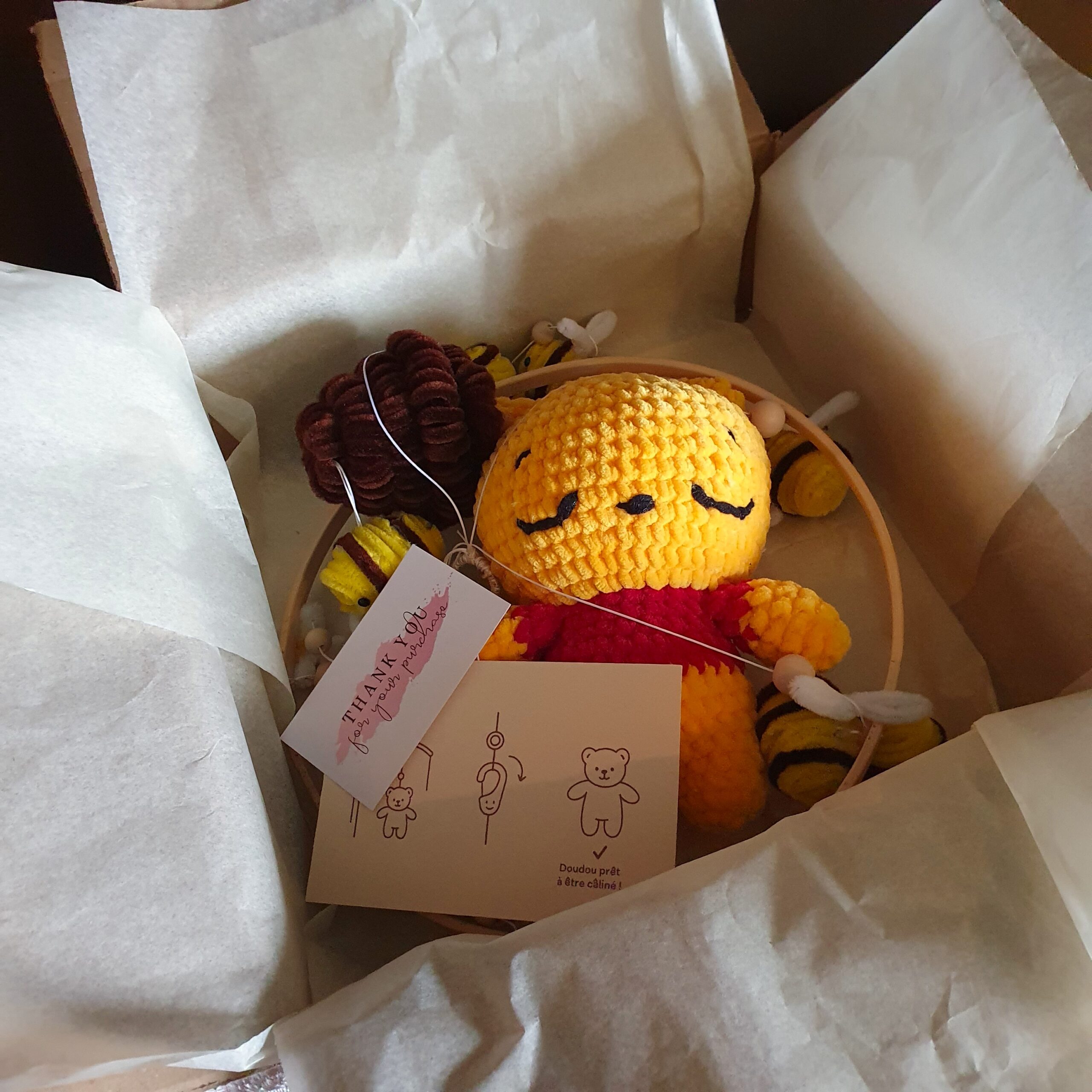 le mobile winnie dans son packaging prés a l'envoie